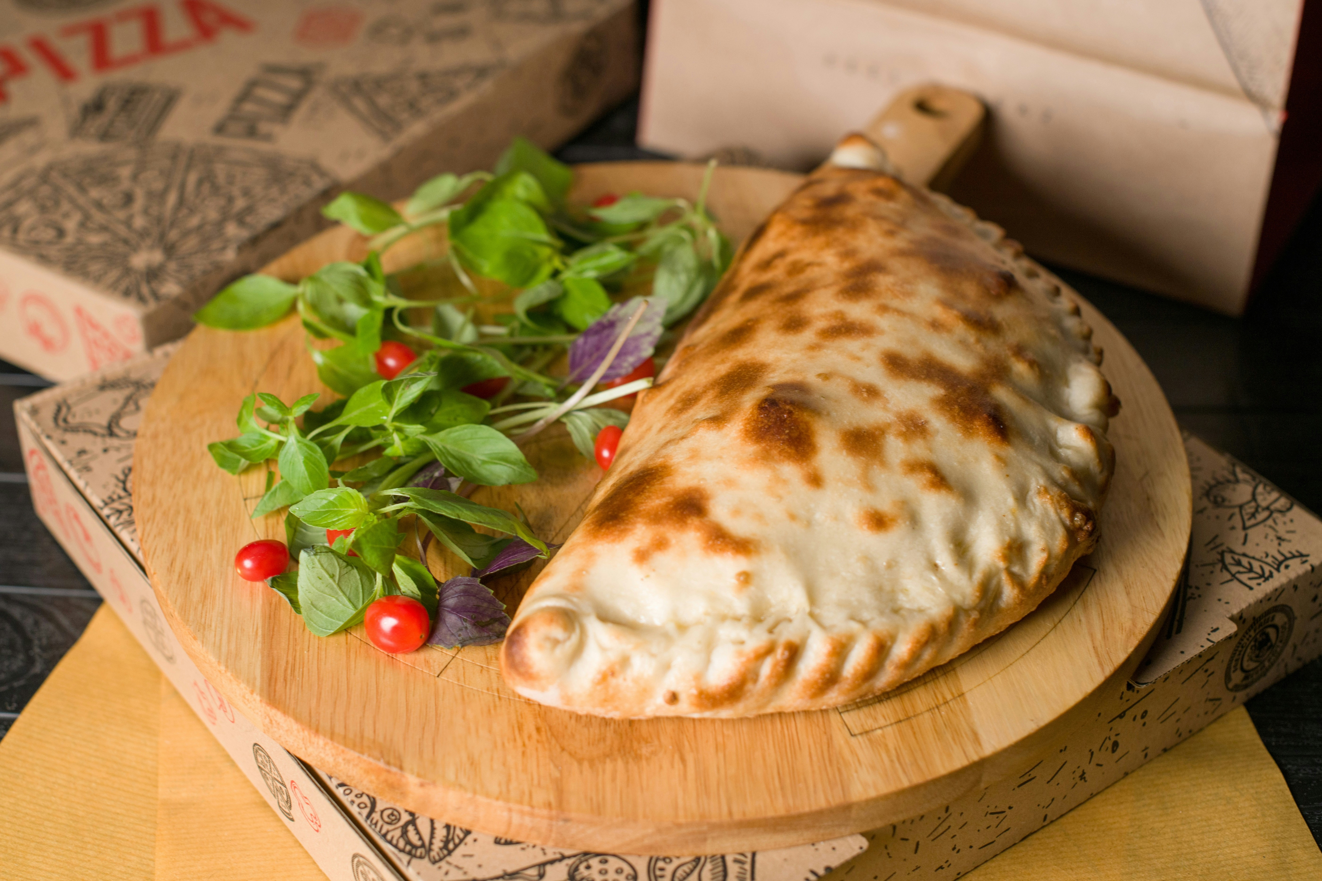 High-protein chicken calzone with crispy parmesan crust and melted cheese