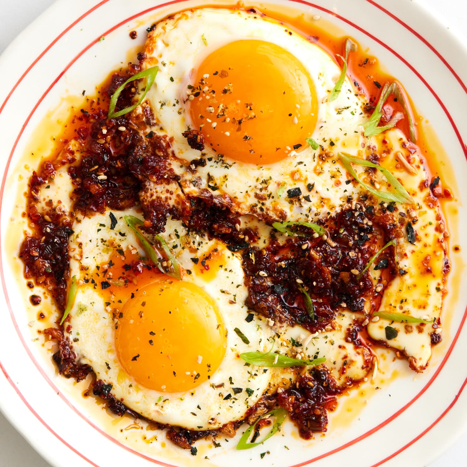 Spicy fried eggs cooked in creamy cottage cheese with chili oil and herbs